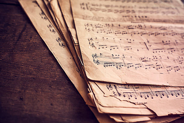 istock Music sheets on wooden background 495243306