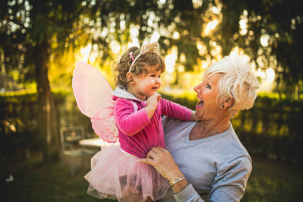 istock Grandmother carying her granddaughter 495243348