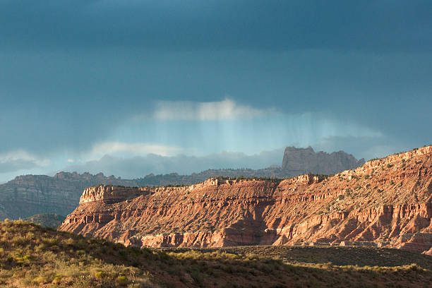 istock Light rays hit sandstone mountains in Arizona 495249482