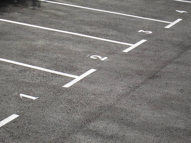 istock Gray parking area numbered one to four 495254704