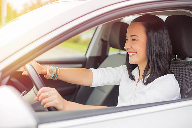 istock Woman driving and smiling 495255062
