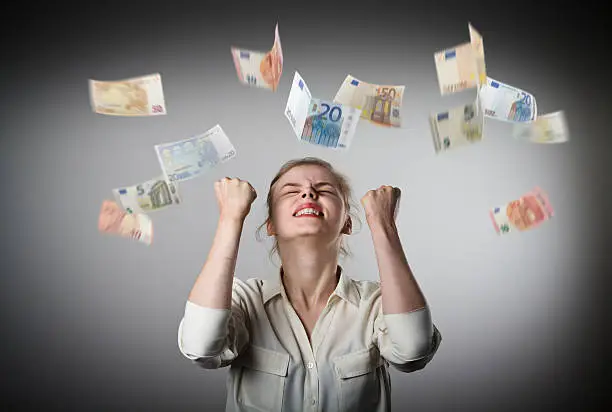 Photo of Rejoicing. Girl in white and Euro.