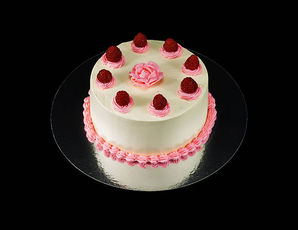 istock One white cake decorated with a rose and raspbarries 495256096