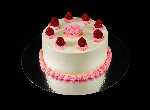 istock One white cake decorated with a rose and raspbarries 495256114