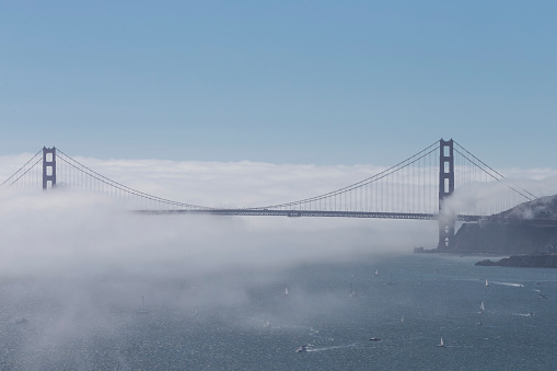 Golden gate bridge with low fog . Photographed from Angels Island.