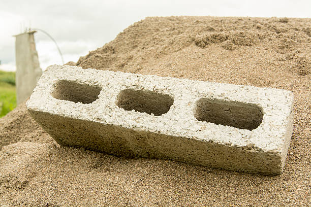 istock Concrete block and construction sand wet 495266654