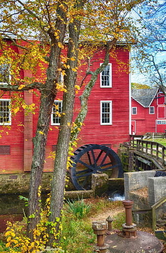 The changing leaves bring splashes of color to the historic Kirby's Mill pond in Medford, NJ.