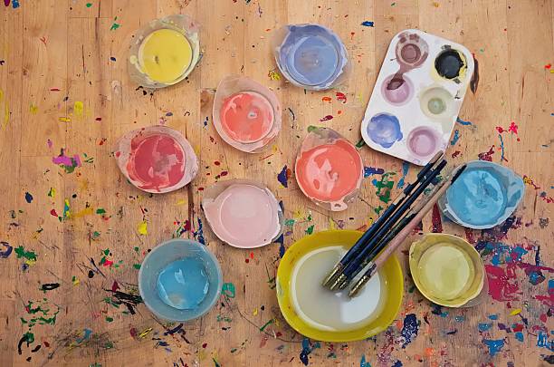 istock Watercolor paint and paintbrush on light colored wood 495268868