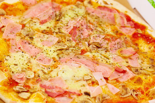 istock pizza with ham and mushrooms 495271344