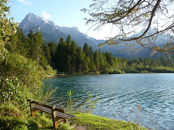 istock Mountains, Lake and a Bench 495271896