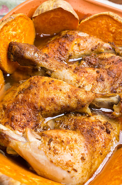 Chicken baked in traditional clay roman pot stock photo