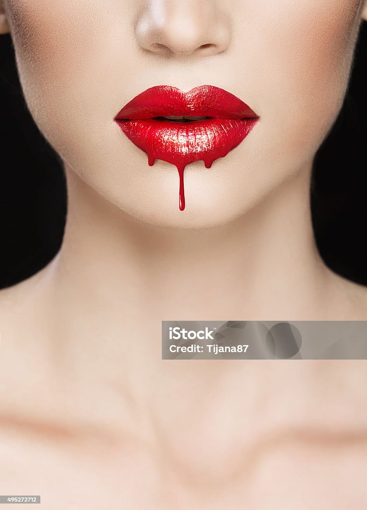 Red lips close-up, make up dripping Vampire Stock Photo