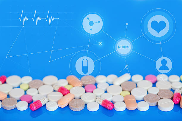 istock Colored pills on a blue background. Medical concept. 495273392