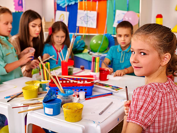 istock Kids holding  on table in kindergarten 495274064