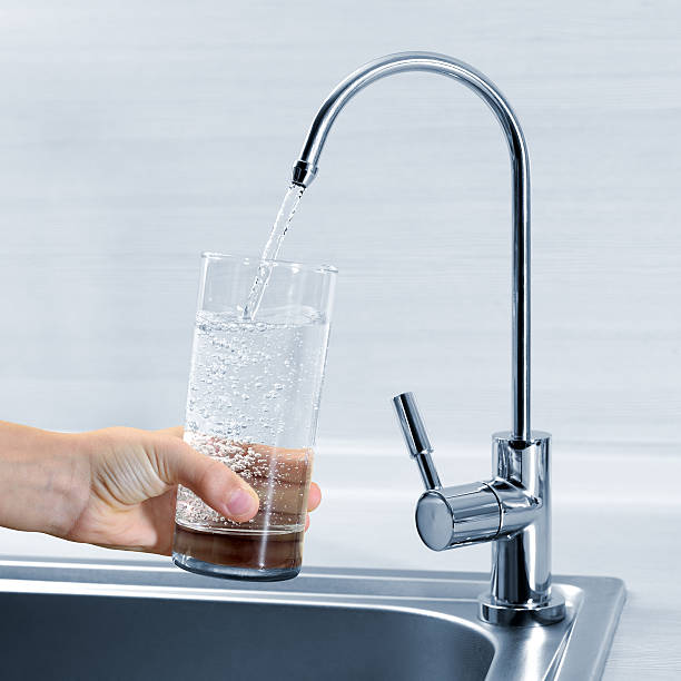 istock Filling glass of water in hand 495276555