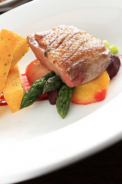 istock pan fried duck breast with pollenta chips 495278139