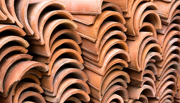 istock Stack of old red roof tiles 495279859