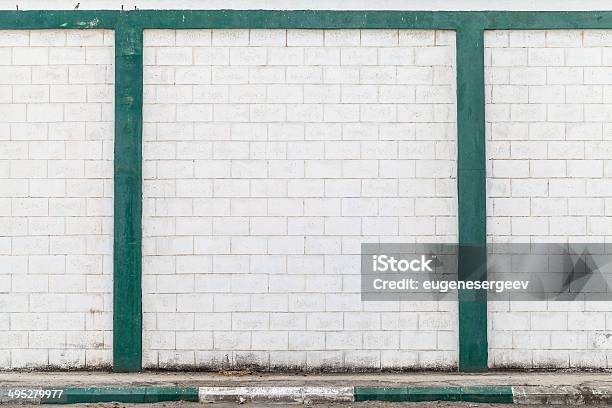 White Brick Wall With Green Decor Elements Stock Photo - Download Image Now - Abstract, Architecture, Backgrounds