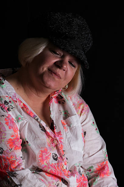 istock Woman Wearing Hat Poses With Eyes Shut 495289110