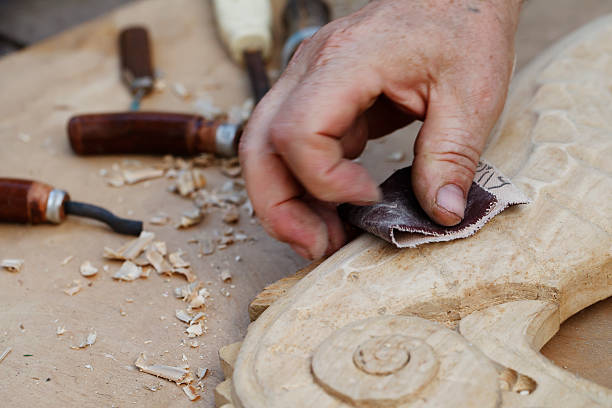 istock wood carvings, tools and processes work closeup 495290474