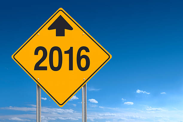 istock New Year Ahead 2016 Sign Post Over Clear Sky Background 495291584