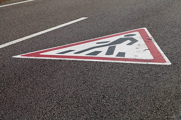 istock pedestrian crossing sign on the pavement 495291702