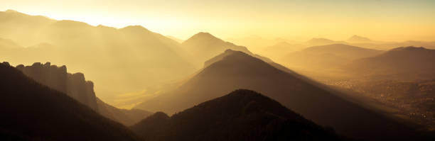 Panoramic scenic view of mountains and hills silhouette at sunse Panoramic scenic view of mountains and hills silhouette at sunset, Mala Fatra, Slovakia high tatras stock pictures, royalty-free photos & images