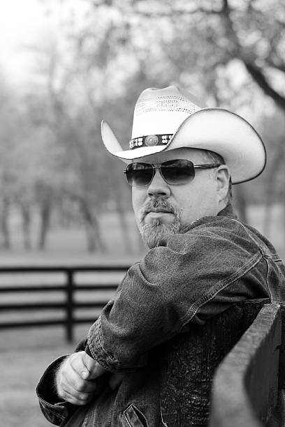 Black & White Image of Cowboy Posing For Camera