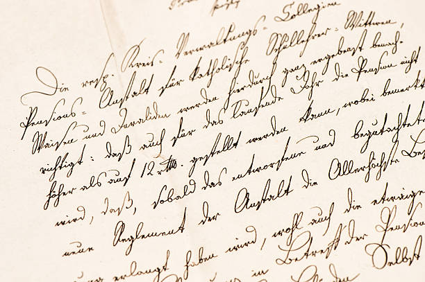 Hand writes words with a fountain pen on paper