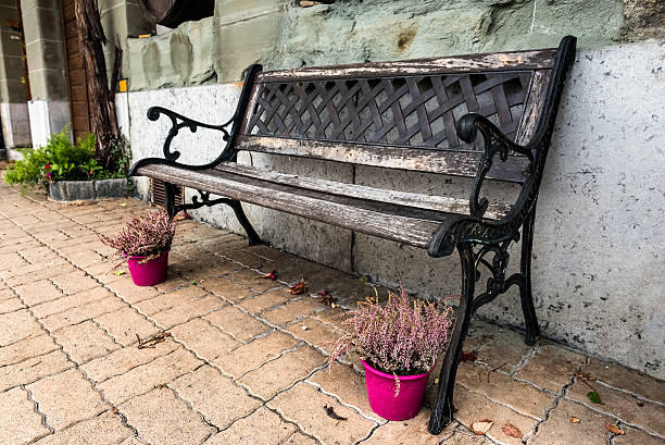istock Stylish bench near the old house. 495294020