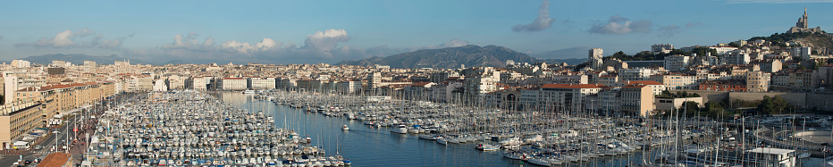 General and panoramic view of Marseille's Vieux Port with Notre Dame de la Garde church at right side