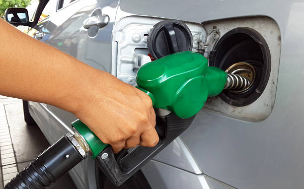 istock Woman hand refilling the car with fuel 495302855