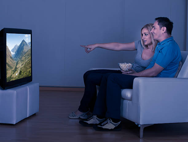 istock Happy Couple Watching Television 495303873