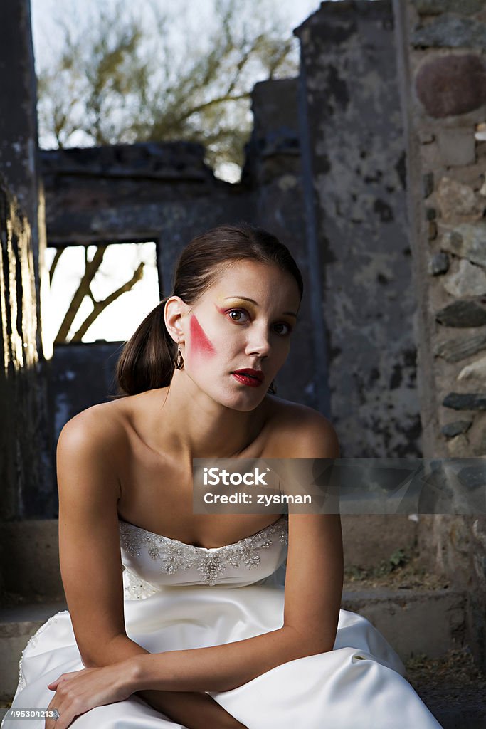 Beautiful Modern Bride A thin bride with heavy red makeup amonst the ruins of a building 20-29 Years Stock Photo