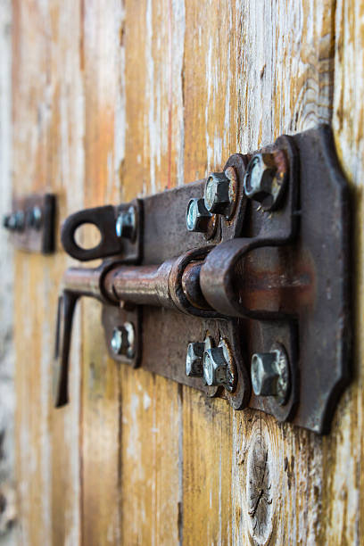 istock old bold on a wood door 495304863