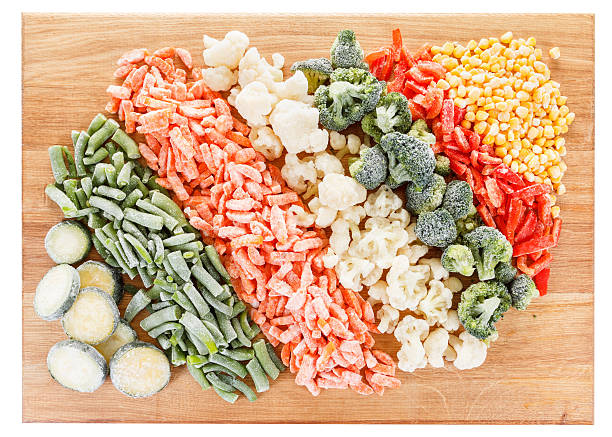 istock Mixed frozen vegetables on cutting board 495311678