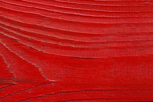 istock wooden red texture closeup vivid background 495312792