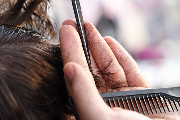 istock master hairdresser and stylist in the working process 495314144