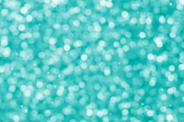istock Green glitter sparkle defocused rays lights bokeh 495314546