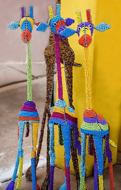 Photo of African traditional bead wire toys animal giraffes.