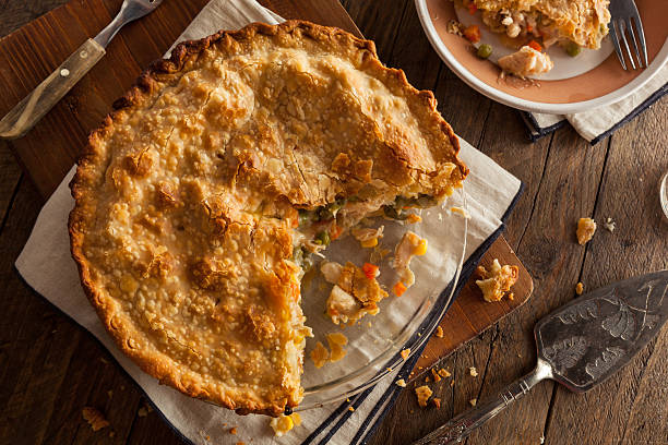 Hearty Homemade Chicken Pot Pie Hearty Homemade Chicken Pot Pie with Peas and Carrots meat pie stock pictures, royalty-free photos & images