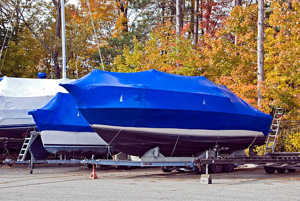 blue tarp on power boat stock photo