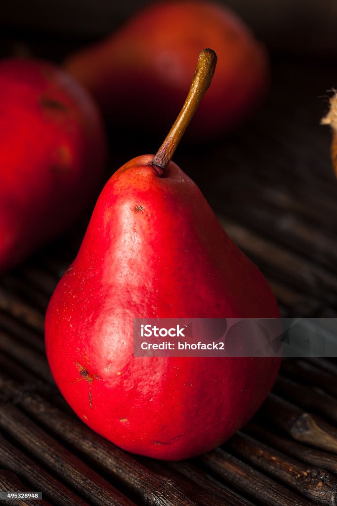 Raw Organic Red Pears Raw Organic Red Pears in a Basket 2015 Stock Photo