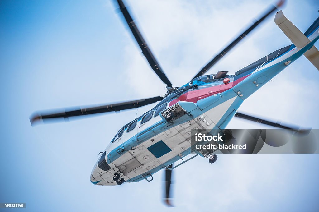 Low Angle Closeup of Helicopter in the Sky Helicopter Stock Photo