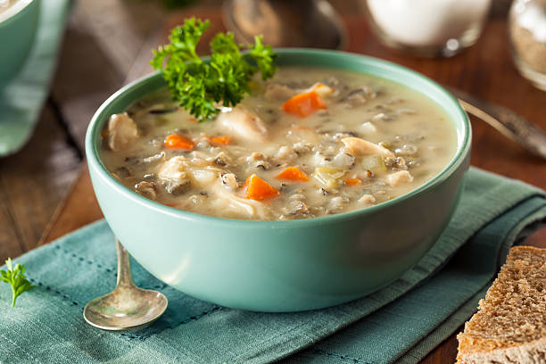 Homemade Wild Rice and Chicken Soup Homemade Wild Rice and Chicken Soup in a Bowl soup stock pictures, royalty-free photos & images