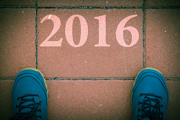 istock Start to new year 2016 - top view of  man 495330086