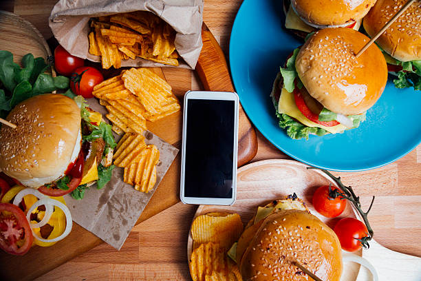 Top view - Hamburgers with moblie phone stock photo