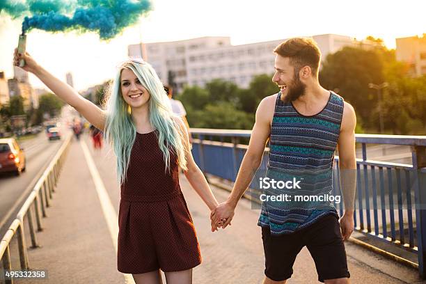 Happy Young Teenage Couple Stock Photo - Download Image Now - Smoke Bomb, 20-24 Years, 2015