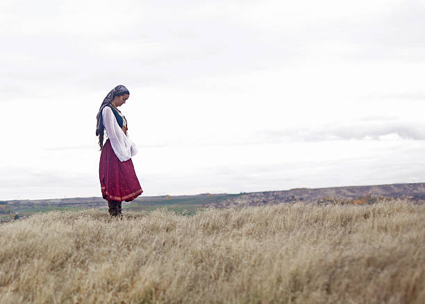 istock Gypsy girl praying 495332952