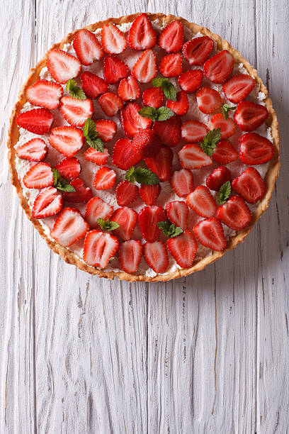 istock Delicious tart with fresh strawberries vertical top view 495333420